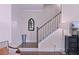 Staircase design with wood treads, white risers, and modern finishes that create a seamless transition at 154 Calm Water Way, Summerville, SC 29486