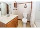 Bathroom with a white toilet and a wooden vanity with a light countertop at 1561 Montclair St, Charleston, SC 29407
