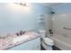 Bathroom featuring vanity with granite top, toilet and tiled tub with shower at 1561 Montclair St, Charleston, SC 29407