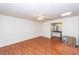 Empty bedroom with laminate floors, ceiling fan, and ensuite bathroom access at 1561 Montclair St, Charleston, SC 29407