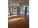 A spacious bedroom with a ceiling fan and multiple doorways at 1561 Montclair St, Charleston, SC 29407
