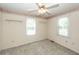 Neutral bedroom with natural light streaming in through the windows at 1561 Montclair St, Charleston, SC 29407