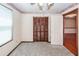 View of a carpeted bedroom with closet, window, and doorway at 1561 Montclair St, Charleston, SC 29407