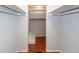 Walk-in closet featuring built-in shelves and hardwood floors at 1561 Montclair St, Charleston, SC 29407