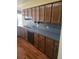 Kitchen featuring wood cabinets, laminate countertop, and stainless steel sink at 1561 Montclair St, Charleston, SC 29407