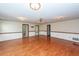 Large living room featuring hardwood floors, neutral walls and a ceiling fan at 1561 Montclair St, Charleston, SC 29407