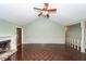 Open concept living room showcasing a fireplace, vaulted ceiling, and access to upper floor at 1561 Montclair St, Charleston, SC 29407