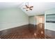 Cozy living room with wood paneling, vaulted ceiling, and hardwood floors at 1561 Montclair St, Charleston, SC 29407