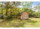 Storage shed with double doors in backyard offers secure storage for your outdoor equipment at 1561 Montclair St, Charleston, SC 29407