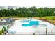 Stunning pool in a community surrounded by lush greenery, with ample lounge chairs for relaxation at 158 Yarrow Way, Moncks Corner, SC 29461