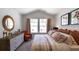 Spacious primary bedroom with ample natural light, stylish decor, and comfortable furnishings at 160 Yarrow Way, Moncks Corner, SC 29461