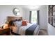 Stylish bedroom with a comfortable bed, tasteful decor, and ample natural light at 160 Yarrow Way, Moncks Corner, SC 29461