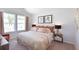 Well-lit bedroom with large windows, neutral decor, and decorative accents at 160 Yarrow Way, Moncks Corner, SC 29461