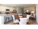 Open-concept dining area adjacent to the kitchen with white cabinets and stainless steel appliances at 160 Yarrow Way, Moncks Corner, SC 29461