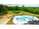 View of community pool, playground, picnic area, pond, and landscaping at 166 Yarrow Way, Moncks Corner, SC 29461