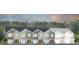 New townhomes showing exterior elevation in a variety of neutral colors, with a tree-lined horizon at 166 Yarrow Way, Moncks Corner, SC 29461