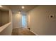 Second-floor hallway with carpet and white walls and doors at 166 Yarrow Way, Moncks Corner, SC 29461