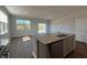 Open concept: granite island overlooks the living area and windows with view of the outside at 166 Yarrow Way, Moncks Corner, SC 29461