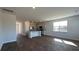 Open-concept space boasts hardwood floors, natural light, and adjoins a modern kitchen at 166 Yarrow Way, Moncks Corner, SC 29461
