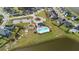 Aerial view of a community featuring a pool, playground, and surrounding homes near a pond at 180 Basket Grass Ln, Summerville, SC 29486