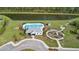 Aerial view of a community featuring a pool, clubhouse, and playground by a pond at 180 Basket Grass Ln, Summerville, SC 29486