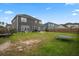 Spacious backyard with lush lawn, a trampoline and view of the house at 180 Basket Grass Ln, Summerville, SC 29486