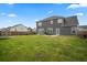 Large backyard with lush grass, fence, patio and view of house at 180 Basket Grass Ln, Summerville, SC 29486