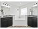 Elegant bathroom boasts dual vanities, granite countertops, and a luxurious soaking tub, designed for comfort at 180 Basket Grass Ln, Summerville, SC 29486