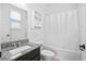 Well-lit bathroom with granite countertops, modern fixtures, and a shower-tub combination at 180 Basket Grass Ln, Summerville, SC 29486