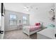 Bright bedroom with two windows, ceiling fan, carpeted floor and decor at 180 Basket Grass Ln, Summerville, SC 29486
