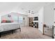 Large bedroom with fan, two windows, tv, neutral carpet and multiple doors at 180 Basket Grass Ln, Summerville, SC 29486