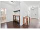 Inviting entryway featuring rich hardwood floors, natural light, and decorative wooden tables for a warm welcome at 180 Basket Grass Ln, Summerville, SC 29486