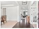 Inviting entryway with hardwood floors, white walls, and views into the dining and living areas, creating an open flow at 180 Basket Grass Ln, Summerville, SC 29486