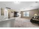 Spacious living room with neutral tones, large windows, and a cozy atmosphere, perfect for entertaining at 180 Basket Grass Ln, Summerville, SC 29486