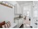 Charming mudroom featuring a built-in bench, storage cabinets, and granite countertops, perfect for organization at 180 Basket Grass Ln, Summerville, SC 29486