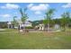 A play area featuring playground equipment, swings, and a seating area with a shed at 180 Basket Grass Ln, Summerville, SC 29486