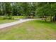Aerial view showcasing the expansive front yard, driveway, and surrounding greenery at 187 Pecan Dr, Summerville, SC 29483