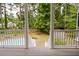 View from the porch overlooking the backyard, showcasing the pool and serene landscape at 187 Pecan Dr, Summerville, SC 29483