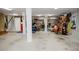 Spacious basement area with support columns, concrete floor, and some storage shelving at 187 Pecan Dr, Summerville, SC 29483