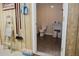 This bathroom features a toilet and sink, and is located next to a ladder and cleaning supplies at 187 Pecan Dr, Summerville, SC 29483