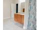 Bathroom boasting a wooden vanity, large mirror, and a shower with a decorative curtain at 187 Pecan Dr, Summerville, SC 29483