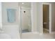 Bathroom featuring a shower with glass door, a blue towel, and tile flooring at 187 Pecan Dr, Summerville, SC 29483