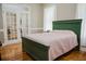 Cozy bedroom features hardwood floors, french doors, and a comfortable bed with a pink quilt at 187 Pecan Dr, Summerville, SC 29483