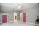 A large bonus room with painted doors, neutral carpet and grey walls at 187 Pecan Dr, Summerville, SC 29483