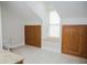 Versatile bonus room offering built-in storage, a window seat, and neutral decor at 187 Pecan Dr, Summerville, SC 29483
