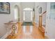 Spacious foyer with high ceilings, hardwood floors, and elegant decor, showcasing the home's grand entrance at 187 Pecan Dr, Summerville, SC 29483