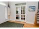 Welcoming foyer with hardwood floors, french doors, and natural light, offering a view into another room at 187 Pecan Dr, Summerville, SC 29483