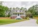 Charming two-story home with a large front porch and well-maintained lawn at 187 Pecan Dr, Summerville, SC 29483