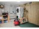 A well-equipped garage space with a washer/dryer, storage cabinets and a variety of cleaning equipment at 187 Pecan Dr, Summerville, SC 29483