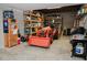 The garage is spacious and contains a red tractor with a plow on the front and shelf storage at 187 Pecan Dr, Summerville, SC 29483